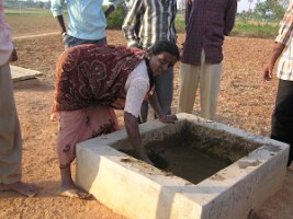 Mixing-dung-and-water-to feed-biogas-plant